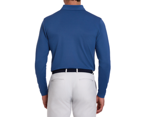 Back view of a man wearing The Abbott Shirt: Andover, a long-sleeve collared polo, tucked into light trousers, with a dark woven belt.
