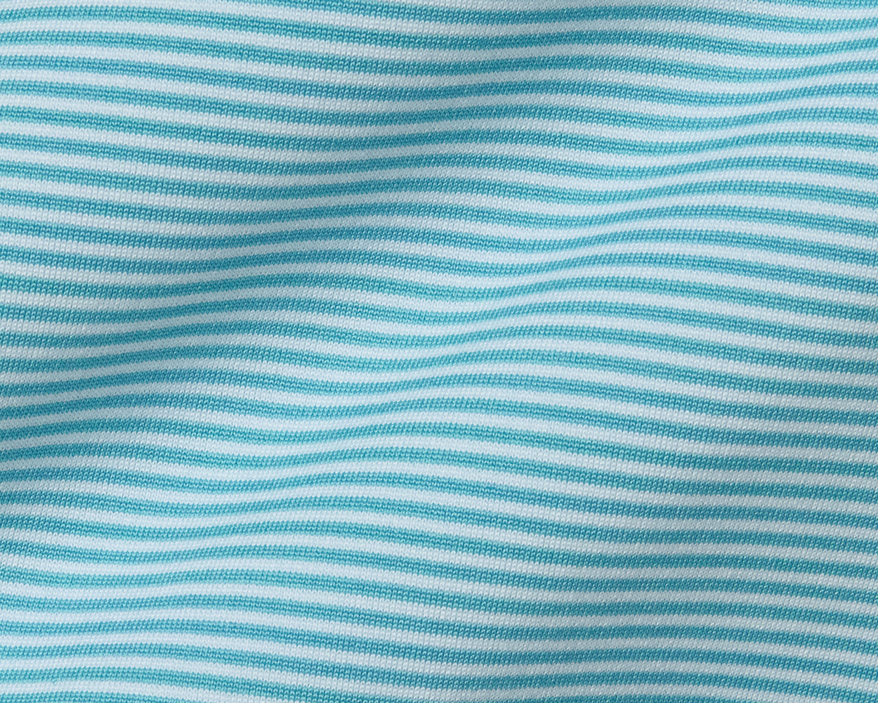 The Burke Shirt: Harbor & White, featuring fine horizontal stripes, showcases a breathable, long-sleeved design with UPF 50+ protection and a structured spread collar.