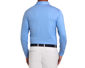 Back view of a model wearing The Burke Shirt: Horizon Blue & White, tucked into light-beige trousers with a dark navy woven belt.