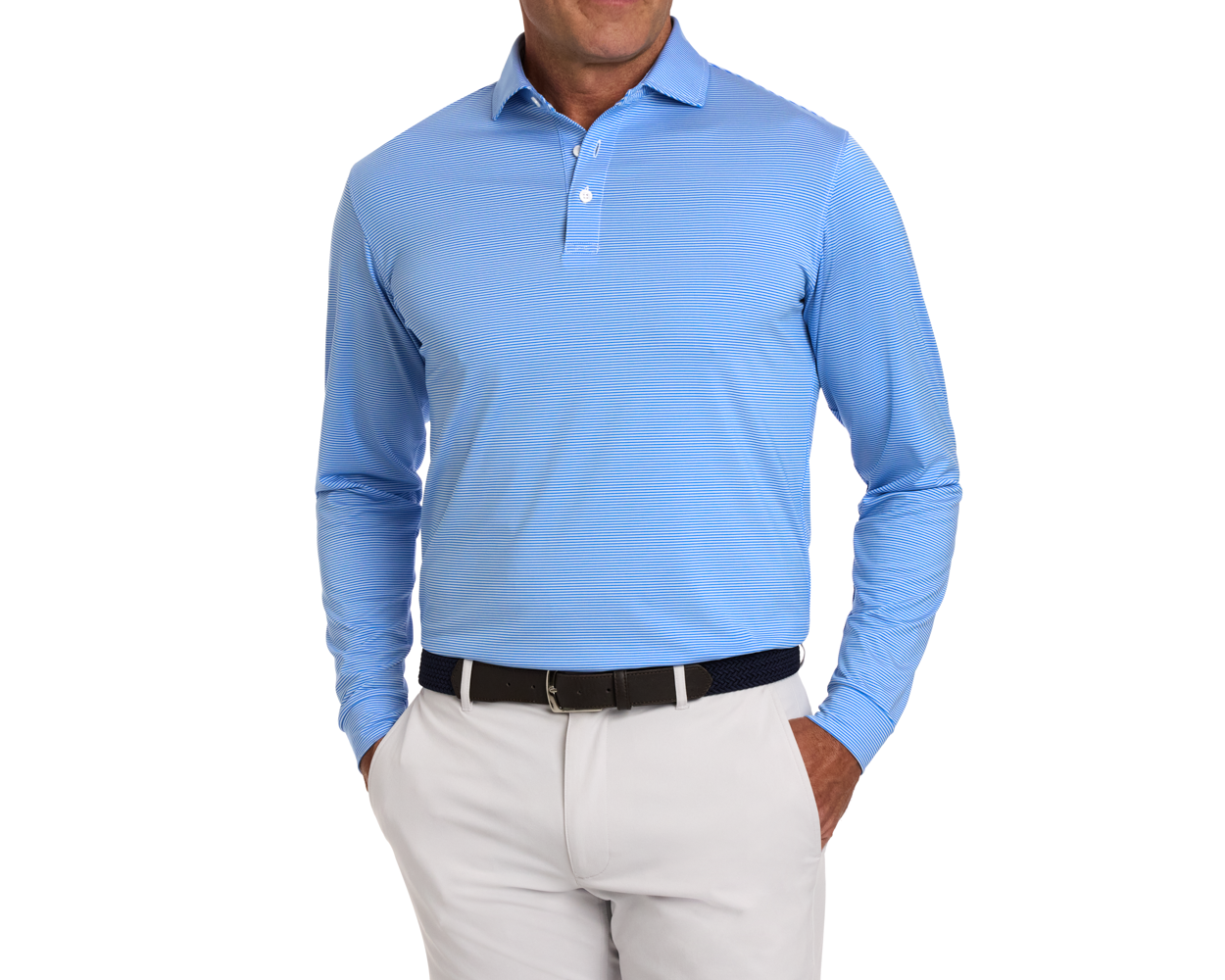 Model wearing The Burke Shirt: Horizon Blue & White, featuring long sleeves, stripes, and a structured collar, paired with light-gray trousers and a braided belt.