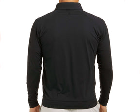 Back view of The Westland Quarter-Zip: Black, showcasing the fit and styling with a small logo below the collar, paired with light-colored bottoms.