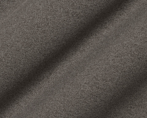 Close-up of The Westland Quarter-Zip: Heathered Driftwood fabric showing a fine diagonal twill texture, highlighting its soft peached synthetic blend.