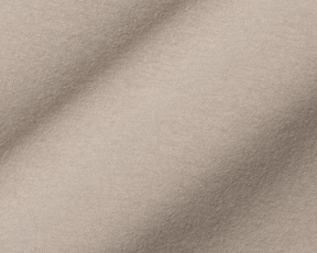 The Westland Quarter-Zip: Heathered Dune, showcasing its fine weave and soft folds, exemplifying moisture-wicking, peached synthetic blend fabric for versatile use.