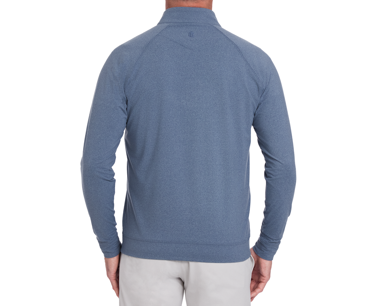 The Westland Quarter-Zip: Heathered Andover, showcasing a mock collar and long sleeves, worn by a model, highlights its athletic style and peached fabric texture.