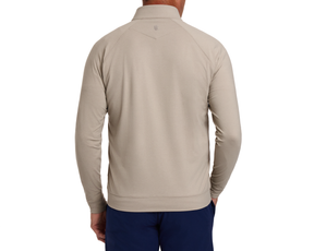 The Westland Quarter-Zip: Heathered Dune, shown from the back, features raglan sleeves, a small logo below the collar, and a clean hem.