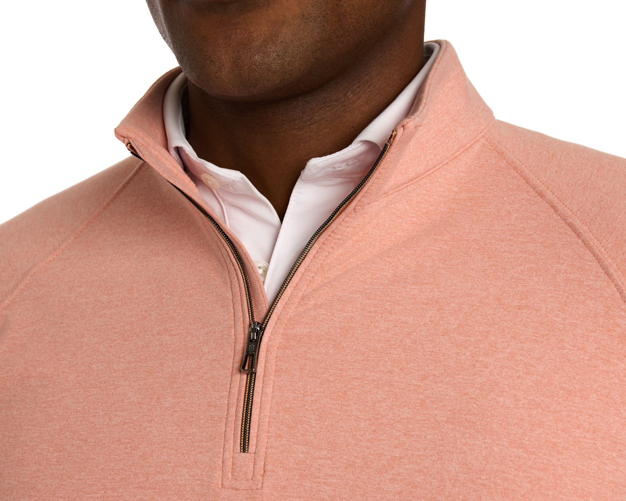 The Westland Quarter-Zip: Heathered Nectarine shown over a white shirt, highlighting its moisture-wicking fabric and gunmetal chrome trim for versatile wear.