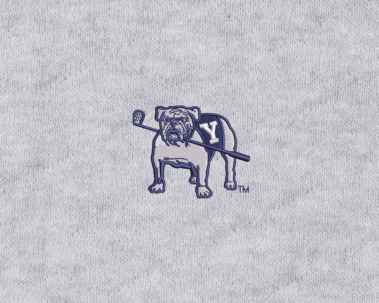 Yale Golf Course Ward Sweater in heathered gray, featuring a knit-look fabric with an embroidered Yale Bulldog mascot in a Y varsity sweater holding a lacrosse stick.