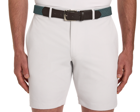 The Fischer Belt: Dark Harbor & Navy Basketweave, woven teal-green with dark brown leather ends and metal buckle, complements light-gray knee-length shorts.