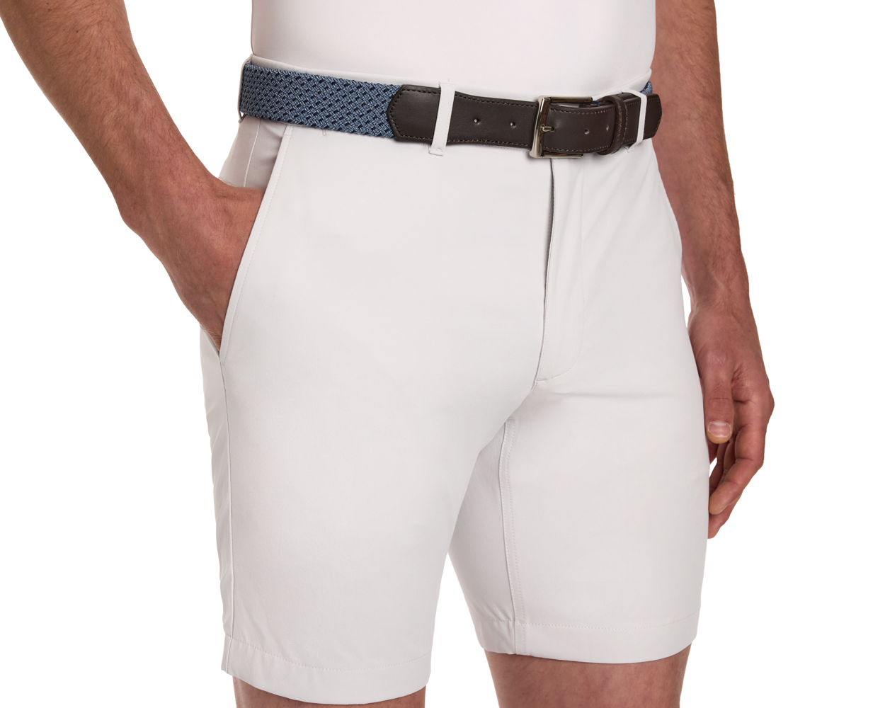 The Fischer Belt: Slate & Navy Basketweave, shown on shorts, features a denim-blue woven design with dark brown leather trim at the buckle.