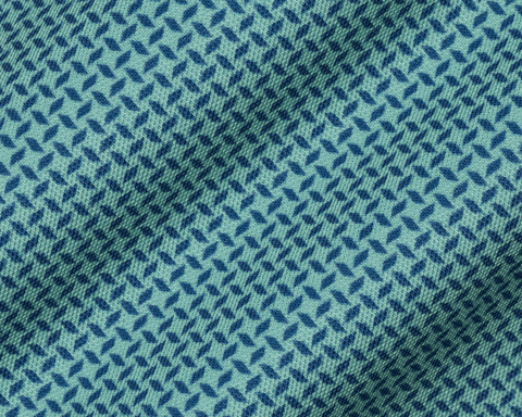 Close-up of The Collins Shirt: Cascade Green & Pacific Blue fabric, showing its refined two-color geometric pattern on a woven pique texture.
