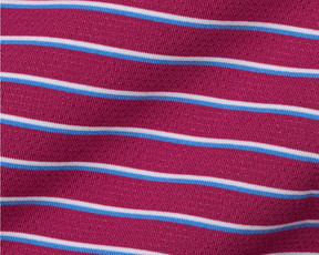 The Springer Shirt features a knit textile with horizontal stripes in white and blue, offering performance with AIRATION® fabric, UPF 50+, and four-way stretch.