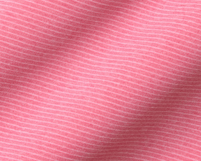 The Holland Shirt: Heathered Belmont, featuring a close-up of its pink knit fabric with fine white stripes, showcasing its lightweight, soft jersey-knit texture and structured collar.
