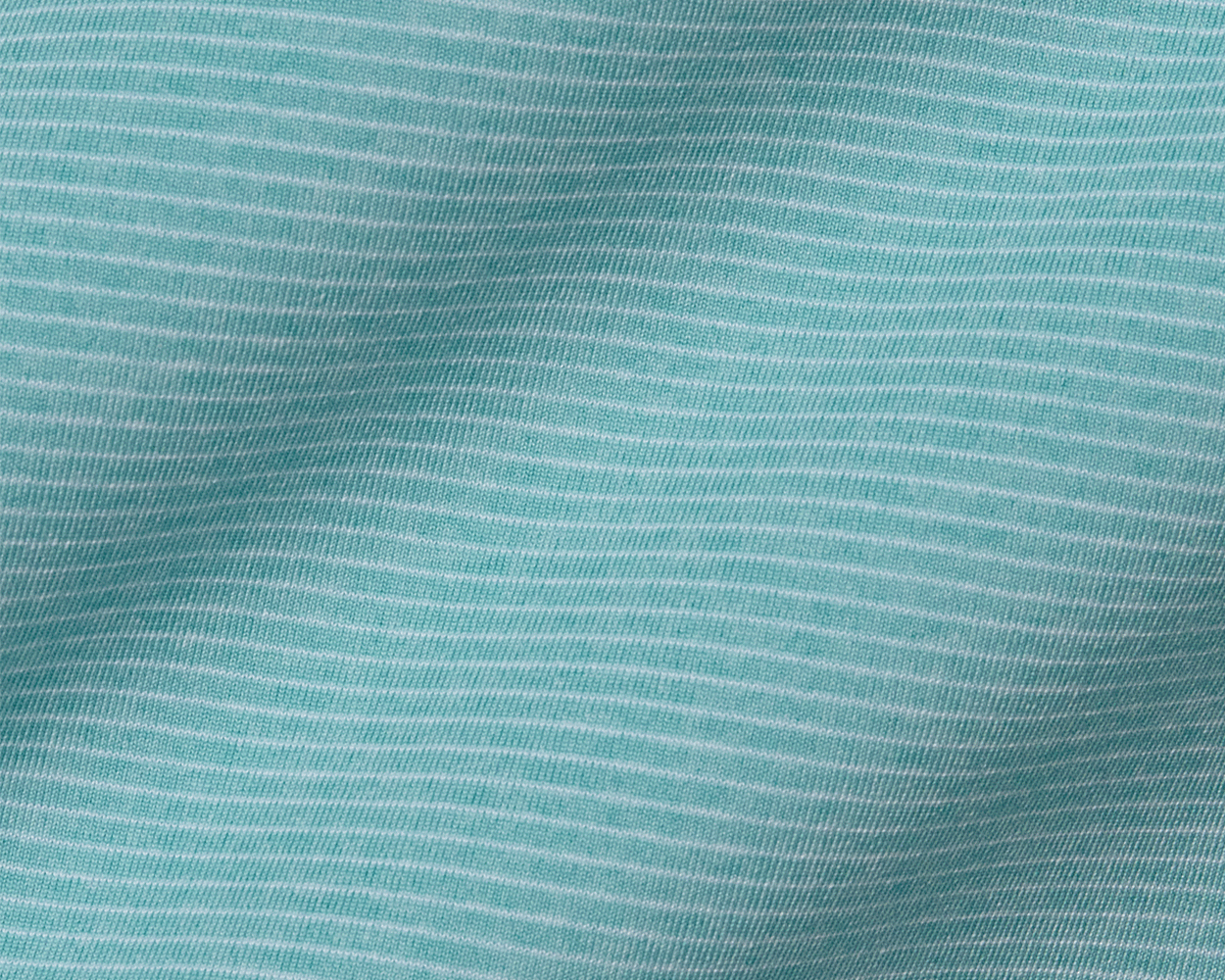 The Holland Shirt: Heathered Harbor features a light teal knit fabric with fine white pin-stripes, showcasing a structured spread collar and signature fit.