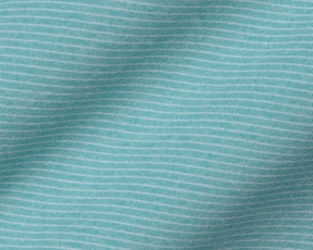 The Holland Shirt: Heathered Harbor features a light teal knit fabric with fine white pin-stripes, showcasing a structured spread collar and signature fit.
