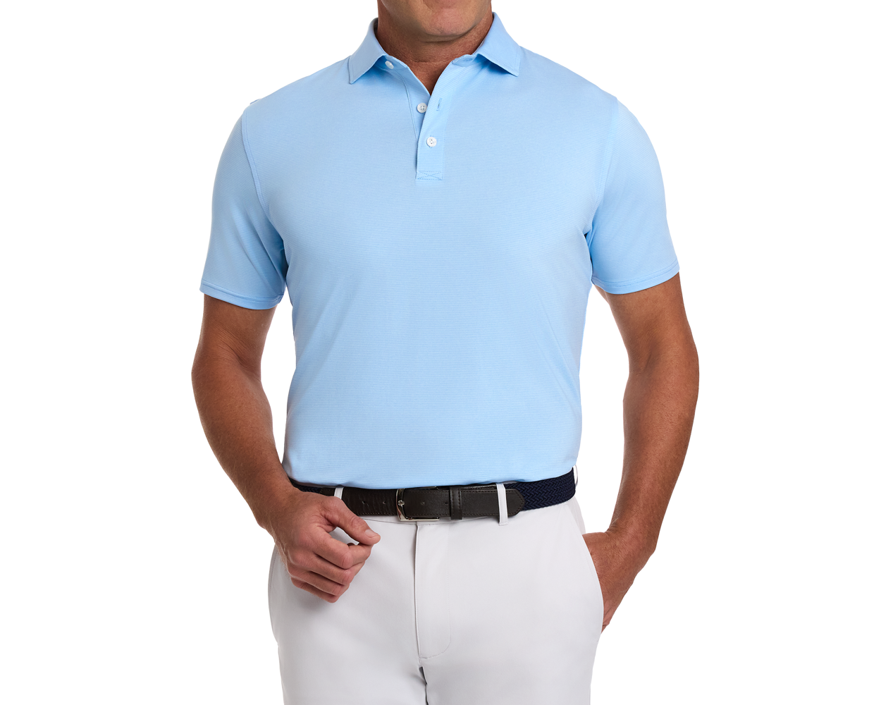 Man wearing The Holland Shirt: Heathered Vista Blue, a light-blue polo with subtle stripes, tucked into light trousers, accessorized with a dark woven belt.