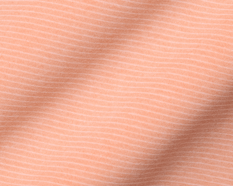 Close-up of The Holland Shirt: Heathered Nectarine, showcasing its soft knit fabric with fine horizontal pin-stripes, subtle texture, and gentle drape.