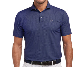 Man wearing Yale Golf Course Frame Shirt: Navy & White, featuring a small visor pattern and bulldog logo, tucked into light trousers with a woven belt.