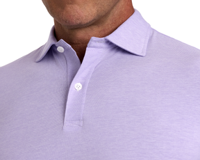 Person wearing The Hatcher Shirt: Tudor & White, featuring a structured collar, two-button placket, and crafted from soft, breathable Peruvian Pima cotton for comfort and flexibility.