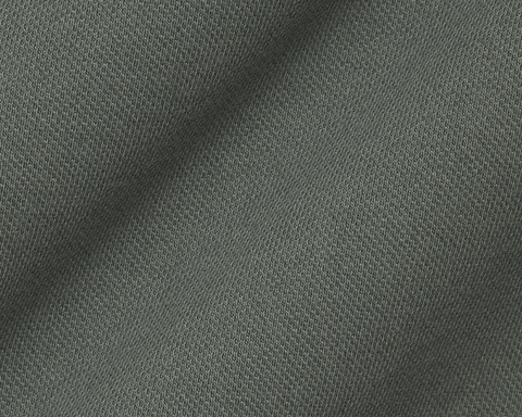 Close-up of The Neville Shirt: Ivy, showcasing its knitted jersey-style fabric with a distinctive V-stitch pattern, highlighting the shirt's soft, durable texture.
