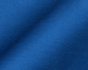 The Neville Shirt: Maidstone Blue, featuring a close-up of its textured knit fabric, showcasing the soft and durable Peruvian Pima cotton blend.