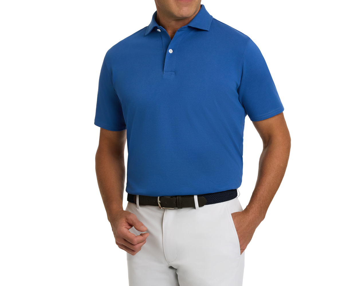 Man wearing The Neville Shirt: Maidstone Blue, a short-sleeve polo in soft Peruvian Pima cotton, tucked into white trousers with a dark woven belt.
