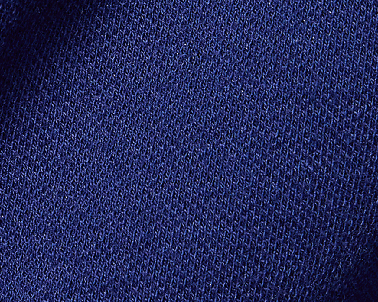 The Neville Shirt: Navy, showcasing a close-up of the fine, textured blue knit fabric, highlighting its soft, durable feel and relaxed collar style.