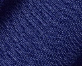 The Neville Shirt: Navy, showcasing a close-up of the fine, textured blue knit fabric, highlighting its soft, durable feel and relaxed collar style.