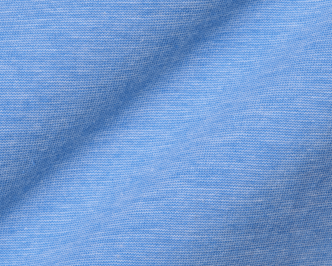 Close-up of The Hatcher Shirt: Horizon Blue & White, featuring light-blue knit fabric with interlocking loops, showcasing its breathable Peruvian Pima cotton and structured spread collar.