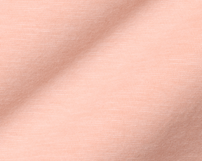 Close-up of The Hatcher Shirt: Nectarine & White, highlighting its soft knit fabric with a textured weave, showcasing comfort and stretch.