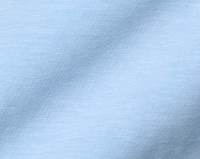 Close-up of The Hatcher Shirt in Vista Blue & White, showcasing fine knit stitches and fabric folds, highlighting its soft, breathable Peruvian Pima cotton blend.