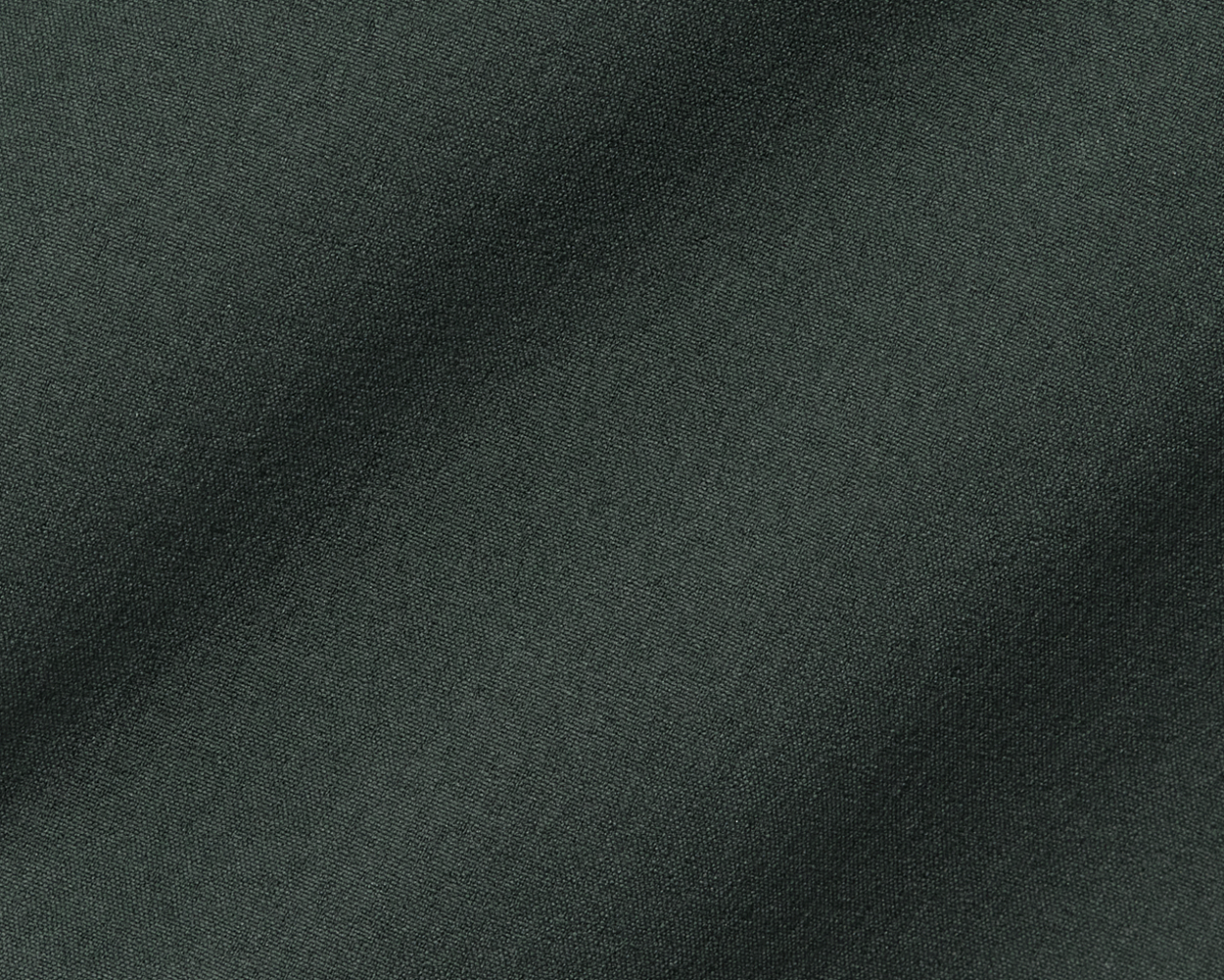 Close-up of The Harwood Short's fine, woven fabric texture, highlighting its soft, stretchable material designed for comfort and performance on or off the course.