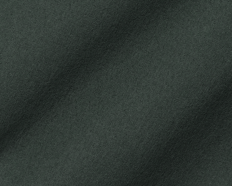 Close-up of The Harwood Short's fine, woven fabric texture, highlighting its soft, stretchable material designed for comfort and performance on or off the course.