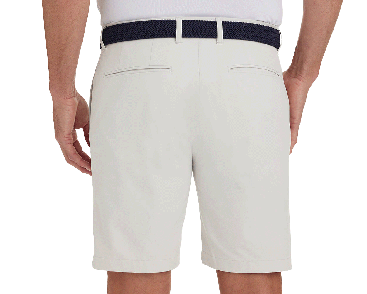 Back view of a man wearing The Harwood Short: Stone, showcasing welt back pockets and a dark navy braided belt, highlighting the shorts' classic style and comfort features.