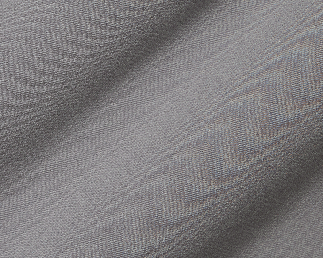 The McDaniel 5 Pocket Pant: Light Gray, showcasing a close-up of its fine woven texture, gentle drape, and wrinkle-resistant, eco-friendly performance fabric.