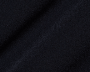 Close-up of The Saunders Short: Black, showcasing its fine knit texture and subtle folds, highlighting its quick-drying, stretchable fabric designed for optimal performance.