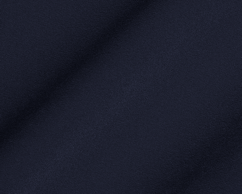 The Saunders Short: Navy, showcasing its dark blue woven fabric with a subtle drape, highlighting the fine weave and texture for optimal performance.