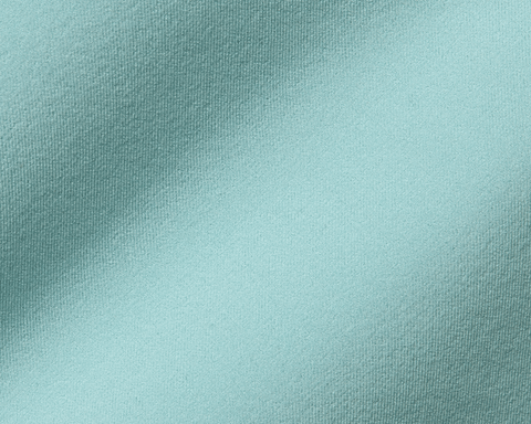 The Harwood Short: Cascade Green, showcasing its light teal fabric, detailed weave, and soft drape, designed for golf comfort with a non-slip waistband.