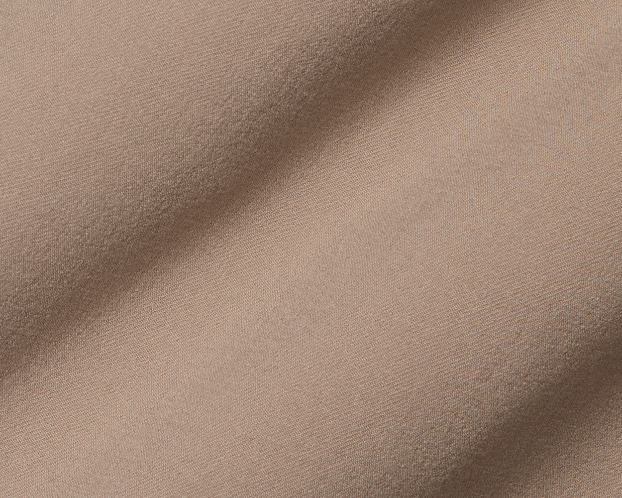 Close-up of The Anson Chino Pant: Fescue, showcasing its fine woven texture and wrinkle-resistant, eco-friendly fabric with four-way stretch for ultimate comfort.
