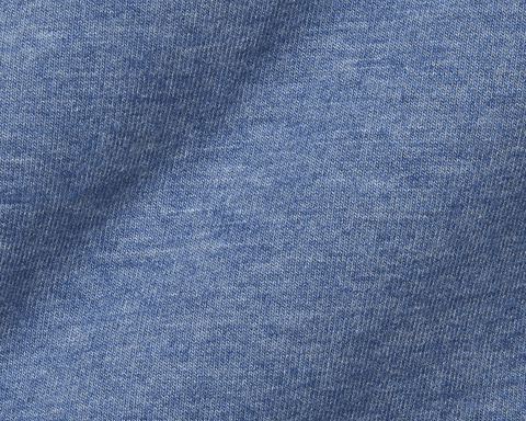 Close-up of The Harper Quarter-Zip: Heathered Bedford showcasing its blue knit fabric with visible looped V stitches, highlighting its soft texture and quality craftsmanship.