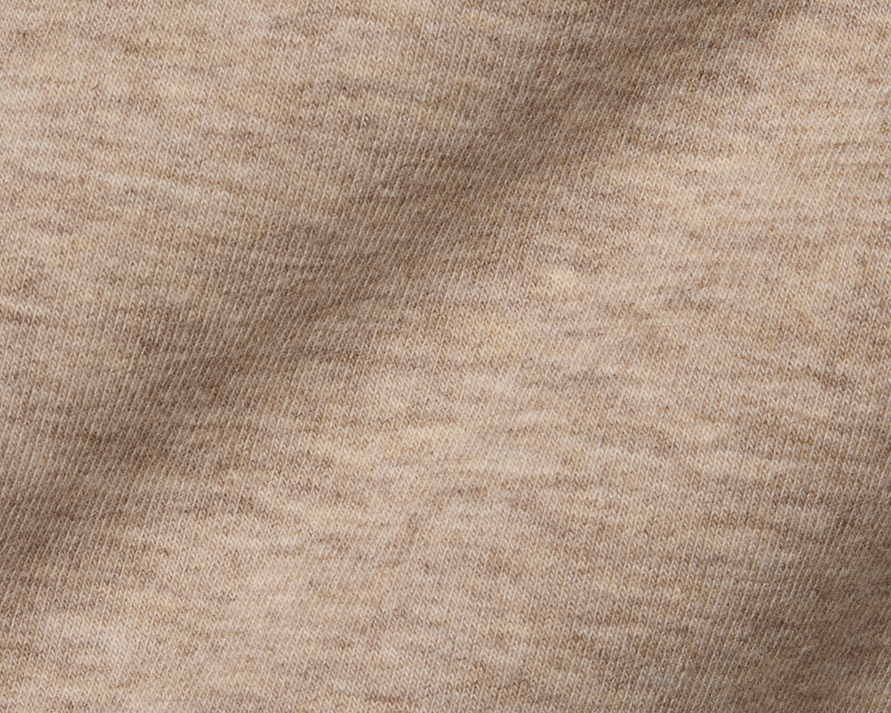 The Lawson Hoodie: Heathered Dune features a close-up of its soft, knitted texture, highlighting the cozy, warm fabric without drawstrings for versatile comfort.