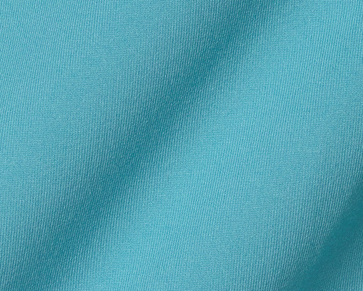 Close-up of The Jackson Hoodie: Harbor, showcasing its fine texture and lightweight knit, tailored for flexibility and comfort during golf swings.