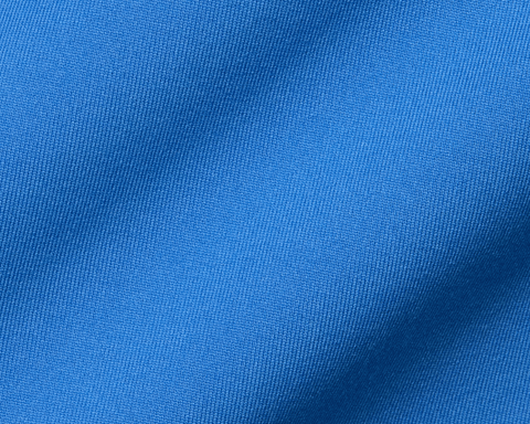 Close-up of The Jackson Boys Hoodie: Horizon Blue, showcasing its fine blue knitted fabric and gentle fold, highlighting its lightweight, streamlined design with 4-way stretch.