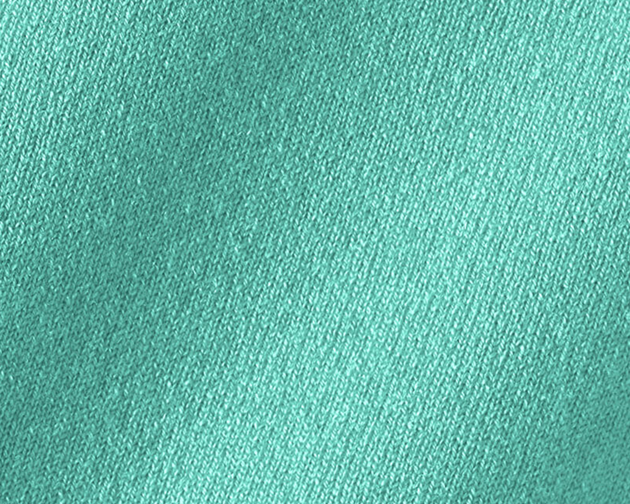 Close-up of The Buckley Crewneck Sweater: Heathered Abaco, showcasing the intricate teal-green knit texture of its 100% Scottish cashmere fabric.