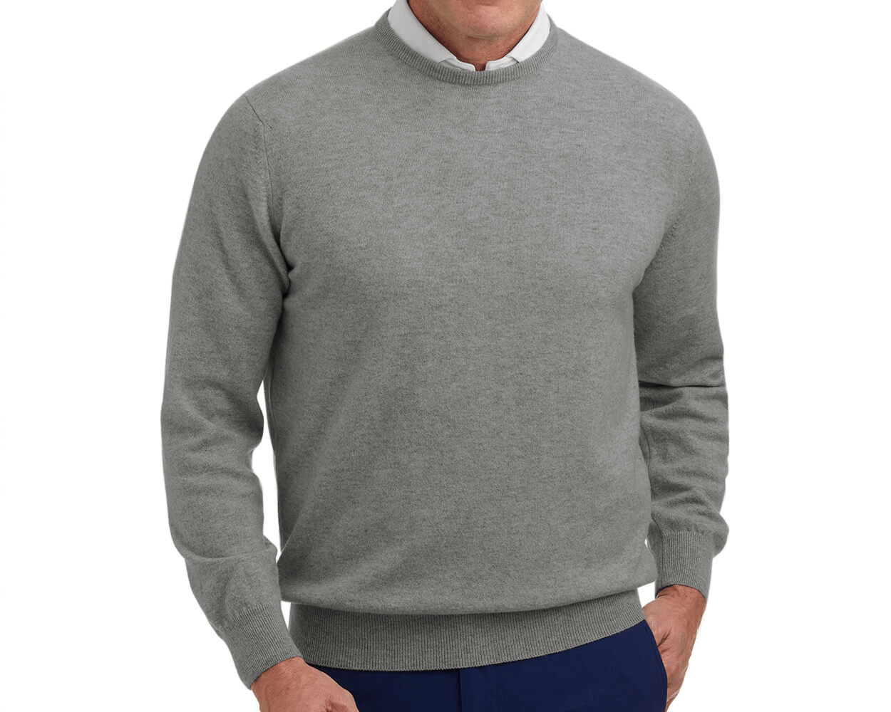 The Buckley Crewneck Sweater: Heathered Gray, shown over a white collared shirt, features ribbed cuffs, hem, and neckline, highlighting Scottish cashmere craftsmanship.