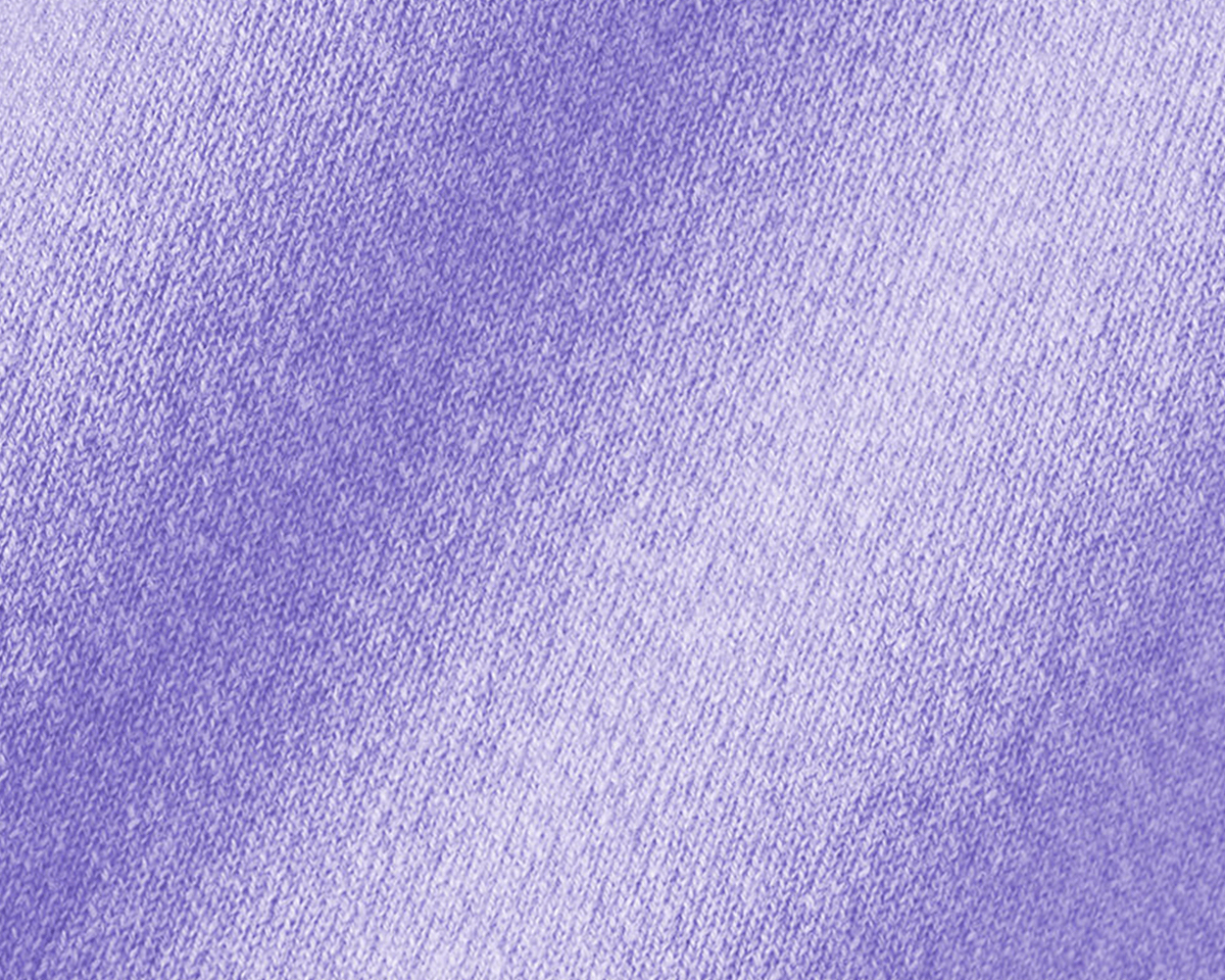 Close-up of The Buckley Crewneck Sweater in heathered lavender, highlighting the intricate knit pattern and durable doubled cuffs in Scottish cashmere.
