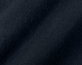 Close-up of The Buckley Crewneck Sweater in Heathered Dark Navy, showcasing 100% Scottish cashmere with a fine diagonal weave pattern and classic crewneck styling.