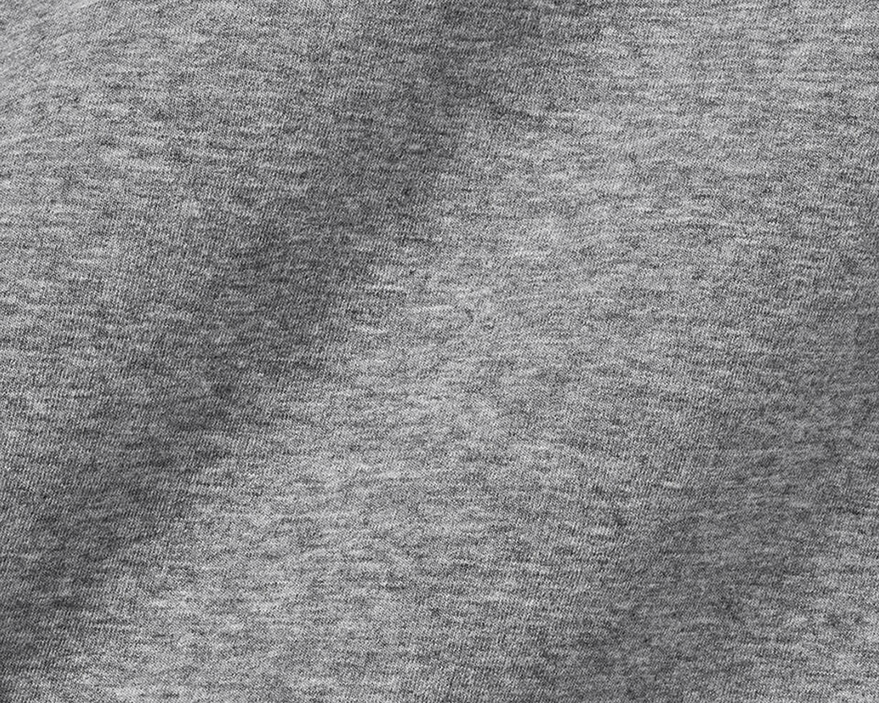 Close-up of The Kennedy Crewneck: Heathered Gray, showcasing its fine jersey knit texture, highlighting the soft, comfortable cotton blend ideal for versatile wear.