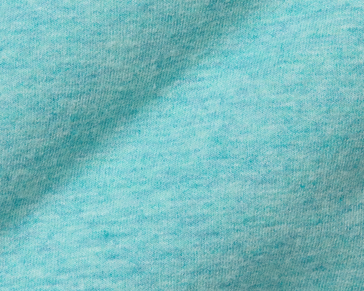 Close-up of The Kennedy Crewneck: Heathered Harbor, showcasing its soft, heathered knit fabric with visible loops, highlighting its comfort and stylish versatility.