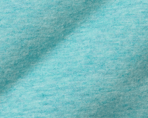 Close-up of The Kennedy Crewneck: Heathered Harbor, showcasing its soft, heathered knit fabric with visible loops, highlighting its comfort and stylish versatility.