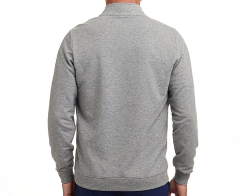 Back view of The Harper Quarter-Zip: Heathered Gray, showcasing its logo below the collar, ribbed cuffs, and hem, worn with dark pants.